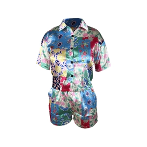 Detailed flat lay of a floral print short-sleeve shirt and matching shorts set