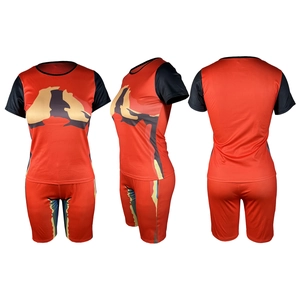 Three-way view of red and black tie-dye print short sleeve top and shorts athletic set