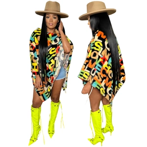 Colorful alphabet print faux fur poncho cape featuring vibrant plush texture and modern style