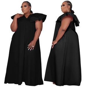 Detail of plus size black maxi dress with oversized ruffle V-neckline and sleeveless design