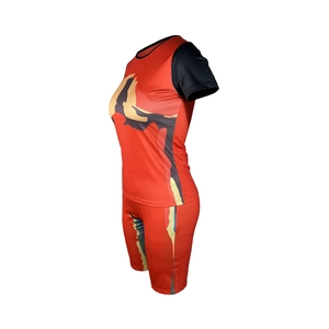 Detail of red tie-dye two-piece sport set with crew neck t-shirt and slim shorts