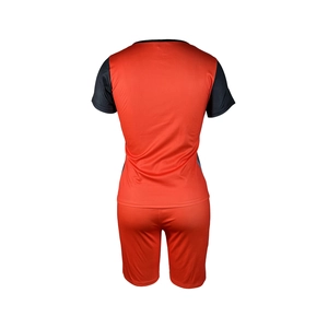 Rear view of tie-dye orange two-piece athletic set featuring round neck top and shorts