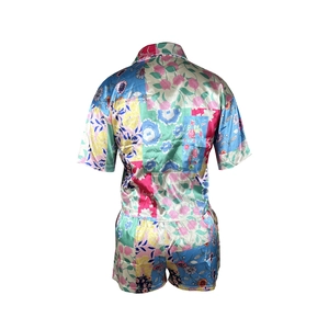 Rear view of two-piece floral print satin pajama set with short-sleeve shirt and shorts