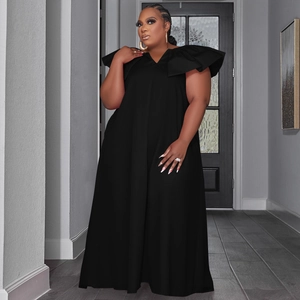 Detail of the plunging V-neck and oversized ruffle sleeves on a black maxi dress