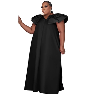 Detail of the plunging V-neckline and tiered ruffle sleeves on this black maxi dress