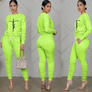 Detailed views of lime green faith tracksuit showing ruched hem and athletic fit