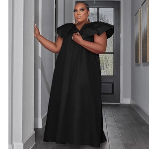 Detail of the layered ruffle sleeve and small V-neckline on the black plus size maxi dress
