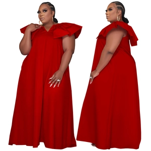 Detail of red plus size maxi dress featuring tiered ruffles and elegant deep V-neckline