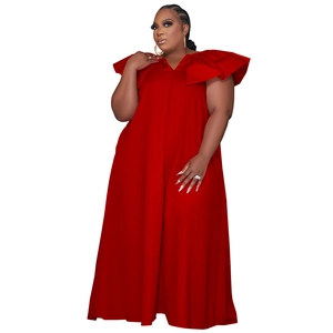 Detail of red plus size maxi dress featuring tiered ruffles and deep V-neckline