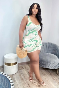 Detail of slim fit romper featuring green marble print and high-stretch knit fabric