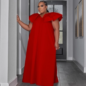 Detailed view of the large ruffled V-neckline on a minimalist red A-line maxi dress