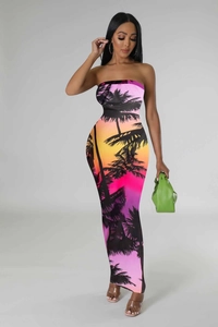 Detail of slim fit tube maxi dress featuring vibrant sunset palm tree digital print