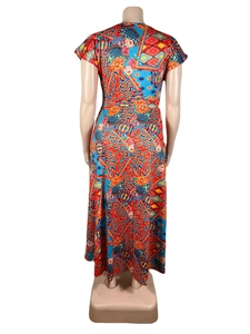 Detail view of colorful geometric and floral print pattern on the back of a maxi dress