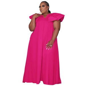 Detail of plus size maxi dress with oversized ruffle shoulders and floor-length hem in rose pink