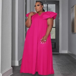 Detailed view of the layered ruffles on the shoulder of this rose red V-neck maxi dress