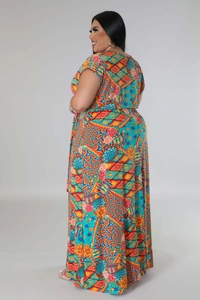 Detail view of plus size maxi dress with vibrant geometric floral print and side profile