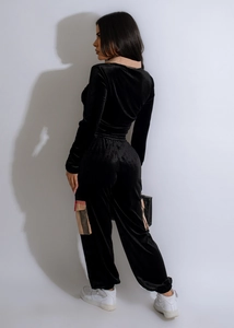 Detail of black velvet tracksuit with classic plaid pattern on cargo pocket side view