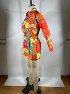 Detail of colorful floral print long sleeve shirt and matching shorts two-piece set