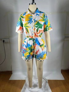 Detail of tropical print shirt and shorts set with decorative scalloped wave lace trim
