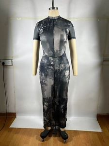 Detailed view of tie-dye ink print texture on ribbed midi dress with curved seams