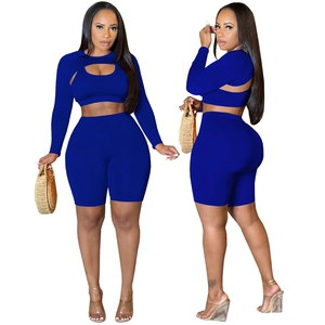 Women's 3-piece navy blue athletic set with hollow long sleeve top and high waist shorts