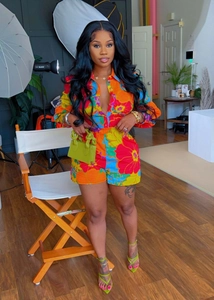 Detailed close-up of tropical floral print long sleeve shirt and matching shorts set