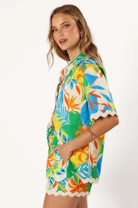 Detail of tropical floral print short set with delicate scalloped wavy edge trim