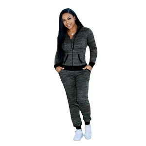 Detail of dark grey marl tracksuit set featuring zip-up hoodie and pocketed joggers