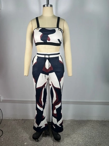 Detail of high-waisted flared pants with drawstring waist and abstract geometric print