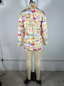 Back view of a long-sleeve vacation shirt with vibrant tropical beach prints on white fabric