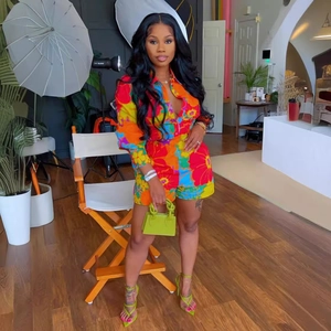 Women's long sleeve floral romper with vibrant tropical flower prints and a stylish collar