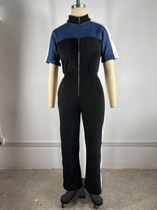 Detail of color-block jumpsuit with stand collar and metal zipper closure