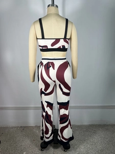 Rear view of two-piece set featuring abstract swirl print vest and wide-leg trousers