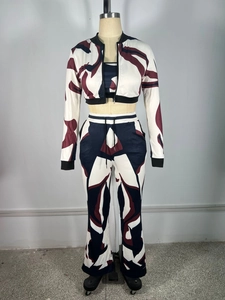 Detailed view of women's 3-piece sportswear set with red blue abstract marble print