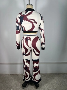 Detail view of the back of a women's two-piece set featuring abstract wave prints