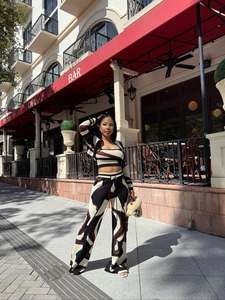 Detailed view of women's 3-piece knit set featuring brown and cream geometric print pattern