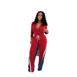 Detail of red and blue denim patchwork tracksuit with white drawstring and zipper closure