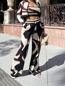 Detailed knit texture of a three-piece women's set with bold geometric color block patterns