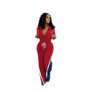 Detail of burgundy tracksuit set with white contrast drawstrings and side stripe design