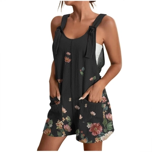 Close-up of floral print summer romper featuring shoulder bows and functional front pockets