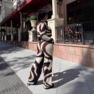 Women's two-piece set featuring long sleeve cardigan and wide-leg pants in abstract swirl print