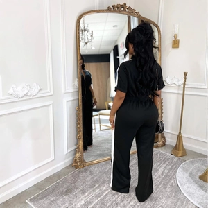 Short sleeve denim patchwork jumpsuit with stand collar and side stripes in black and white