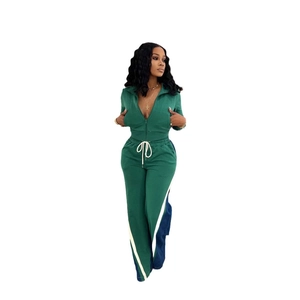 Women's 2-piece dark green tracksuit with zip-up jacket and striped straight-leg pants