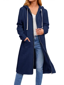 Detail of navy blue longline zip-up hoodie with drawstring hood and large pockets