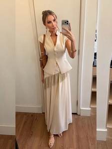 Elegant cream two-piece set featuring a tailored waistcoat vest and maxi skirt with fringe