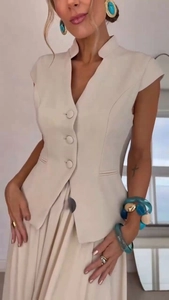 Close-up of elegant beige vest suit with single-breasted buttons and tailored fit