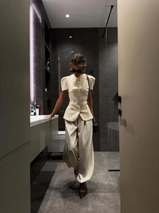 Elegant off-white two-piece set featuring puff sleeve jacket and high-waisted wide-leg pants