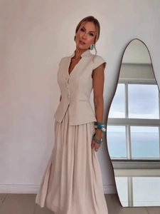 Elegant women's two-piece set featuring a tailored vest top and a flowing chiffon maxi skirt