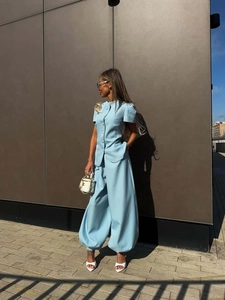 Elegant light blue women's fashion set with short sleeve jacket and high waist wide leg pants