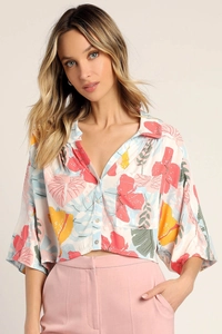 Detail view of cropped tropical print shirt with lapel collar and single chest pocket